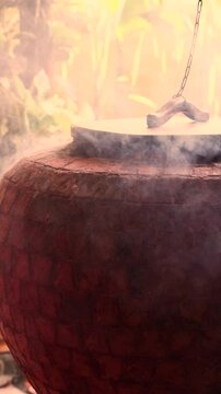 A stone brick tandoor oven in a luxurious restaurant for roasting meat and fish in the tandoori style.