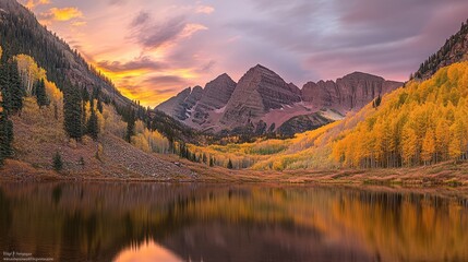 Fototapeta premium A breathtaking mountain view at sunrise, with vibrant colors illuminating the peaks and a serene lake reflecting the scene.