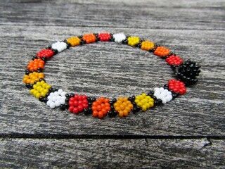 Mexican seed beads bracelet on wooden background