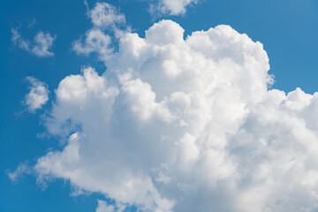 Clouds at the sky. Cloudscape - Blue sky and white clouds. Beautiful blue sky background with clouds. White fluffy clouds in the blue sky. Blue sky and white clouds of daytime