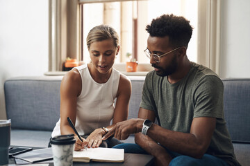 Creative business people, writing and discussion in office for startup, support and small company agency. Designer, notebook and art director happy for project proposal, collaboration and advice
