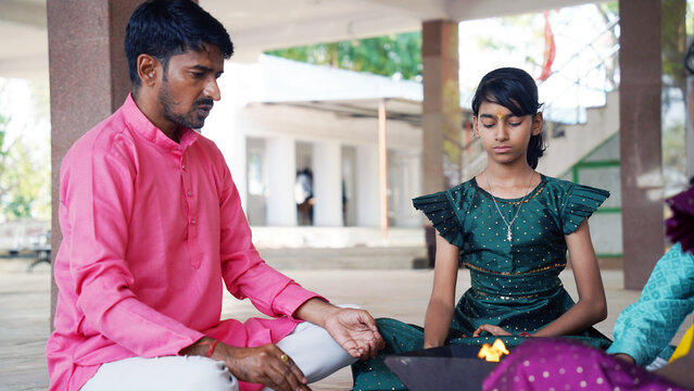 Indian Family Performing Yagya or havan Ritual for Vastu Blessings During Festival, havan kund