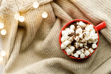 Cocoa and marshmallows in red ceramic cup