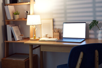 Cozy Home Office with Laptop, mockup blank screen.