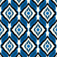 Fototapeta premium Ikat seamless pattern, geometric design, motif ethnic handmade, Ikat ethnic tribal, boho colors seamless wallpaper. Ethnic Ikat abstract background art,