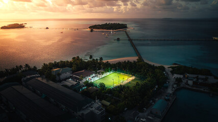 football pitch view in a tiny tropical island with sunset sky