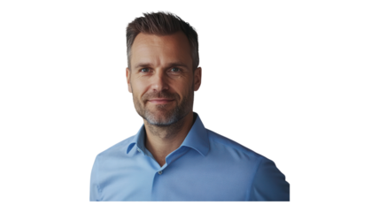Confident man smiling in a light blue shirt against a neutral background showcasing a professional appearance and relaxed demeanor.