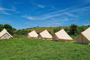 Scenic Summer Glamping Tents in Idyllic Countryside Setting for Outdoor Escape