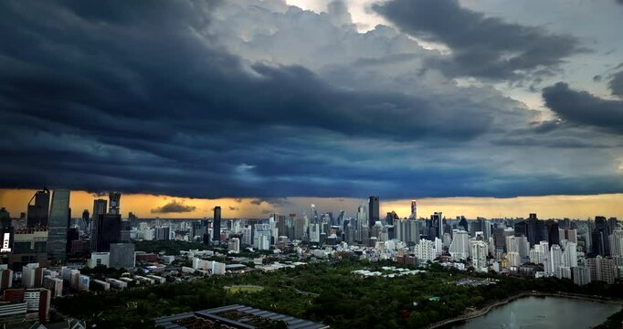 Bangkok skyline with dramatic cloudscape view from Benchakitti Park, aerial