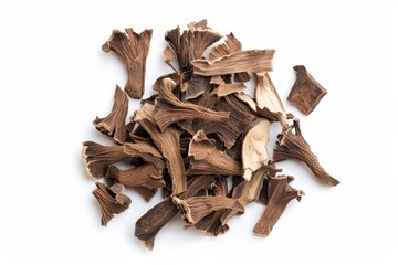 Overhead of dried chicory root pieces on white background