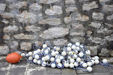 Mooring rope and floats. Fishing buoy and nautical rope