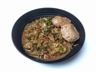 Gado gado isolated on white background. Gado-gado is a dish consisting of vegetables seasoned with peanut sauce and so on.