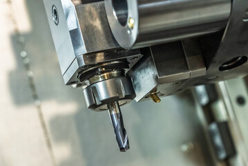 Inside view of a cnc machine. CNC lathe interior.Cnc machine. The CNC lathe machine or Turning machine. Turning numerical control machine with tools and chuck.