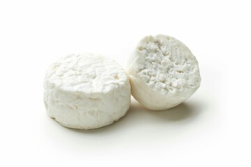 Two goat cheese rounds on white background