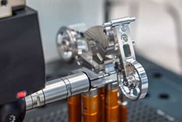 3D coordinate measuring machine. 3d precision measurement on machine quality control parts. Measuring machine for finished parts after cnc machining. Measuring machine.