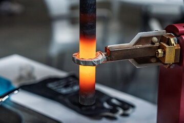 Surface hardening of steel. Induction hardening type of surface hardening . Metal part is induction-heated and then quenched. Quenched metal. Induction heating  process. Electromagnetic induction.