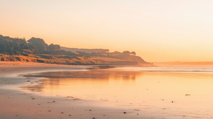 Sunrise sky over a calm beach, warm orange and pink hues, serene and peaceful, perfect for morning-themed stock images,