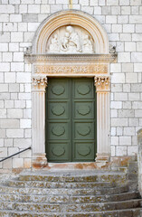 Old wooden door in a church, Hvar, Croatia