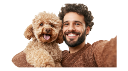 Happy man smiles while taking a selfie with his fluffy dog at home during the day.