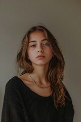 Fototapeta premium Portrait of a girl with a minimalist background
