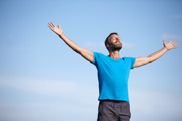 Outdoor, hands up or man breathing for meditation, freedom or holistic health with calm soul....