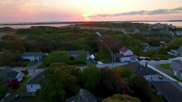 aerial fast pullout at sunrise over boats in hyannis port massachusetts