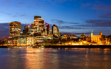 Obraz premium City of London skyscrapers and Tower of London at sunset, UK
