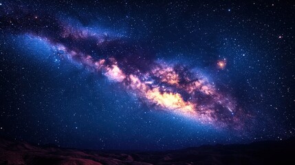 Fototapeta premium A stunning view of a galaxy filled with stars and cosmic colors against a dark backdrop.