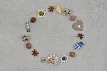 Simple Christmas decorations: ornaments arranged in a circle with empty space in the middle to fill with content, top view.