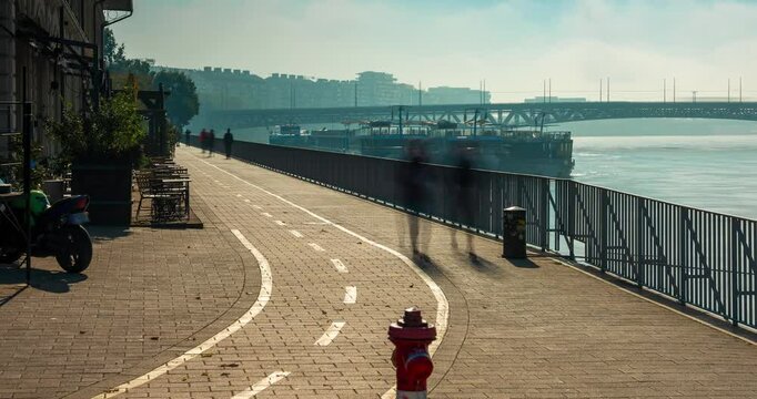 Budapest, Hungary - October 10, 2024: Budapest&rsquo;s Pathways Along the Danube Near Balna, foggy morning. Timelapse, zoom out transition.