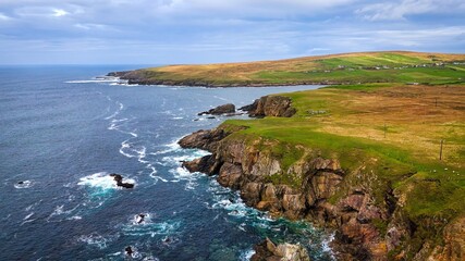 Naklejka premium A Beautiful Coastal Landscape Featuring Rocks and Glimmering Water, Capturing Natures Splendor