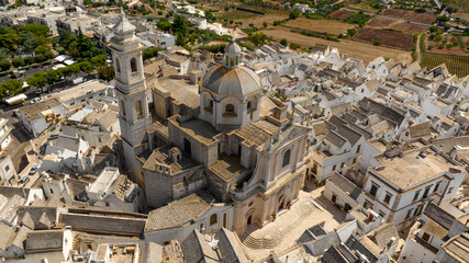 Aerial view of the church of San Giorgio Martire in Locorotondo, in the metropolitan city of Bari,...