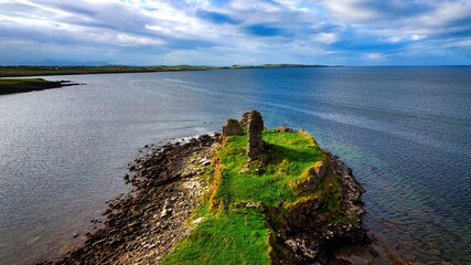 St John s Point in Donegal at the west coast of Ireland - a breathtaking coastal view showcasing a historic ruin that stands proud by the sea