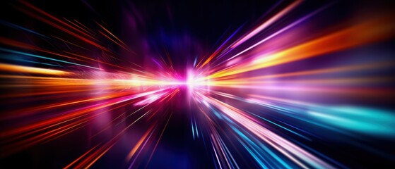 Obraz premium Vibrant light streaks in a dynamic display of colors on a dark background.