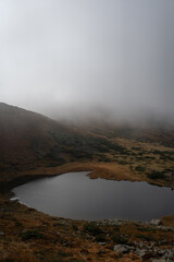 Tranquil Mountain Lake Shrouded in Autumn Mist