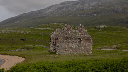Ruins, abandoned sheds, fog, rugged rocks, rolling hills and mountains characterise the Scottish landscape.