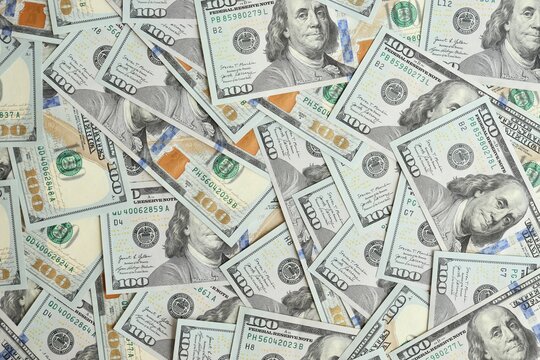 Big amount of american USD hunderd dollar bills banknotes close up