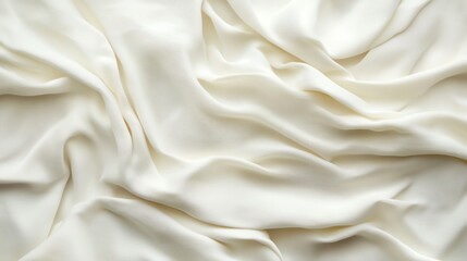 Fototapeta premium Elegant white silk fabric draped beautifully, showcasing smooth texture and soft folds.
