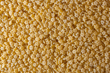 Uncooked Stelline Pasta: A Culinary Canvas of Stelline Macaroni, Creating a Lively and Textured Background for Gourmet Cooking. Dry Pasta. Raw Macaroni - Top View, Flat Lay