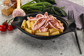 Italian cuisine - pasta tortiglioni with squid