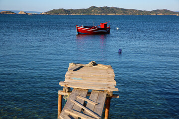 Red fishing boat on the pier