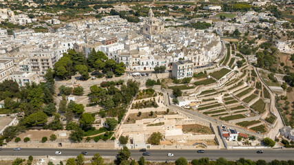 Obraz premium Aerial view of the historic center of Locorotondo, in the metropolitan city of Bari, Italy. It is located on a hill in the Itria Valley in Puglia.