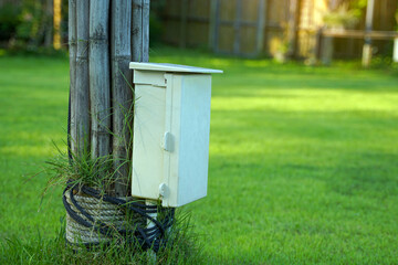 Waterproof switchboard cabinet with roof installed outside the building in the courtyard to be used as an electrical source inside or outside the building.