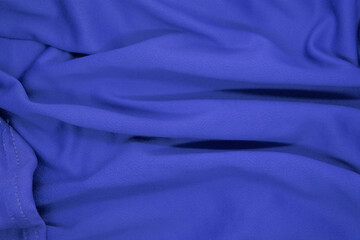 Abstract texture a wrinkled navy blue blanket