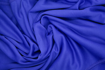 Abstract texture a wrinkled navy blue blanket