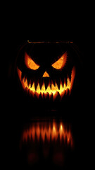 Fototapeta premium Halloween pumpkin with fangs on black background