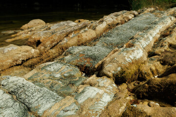 stones on the river and mountains in the forest close-up. Beautiful natural background.