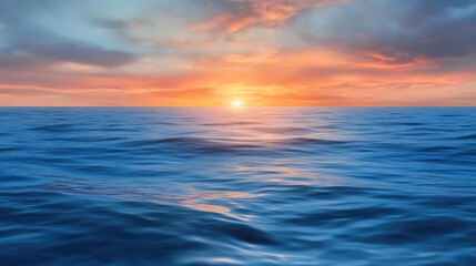 Fototapeta premium A serene sunset over the ocean, creating a tranquil and picturesque seascape.