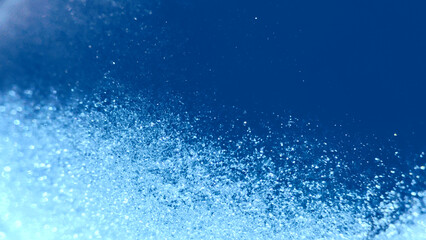 Colorful Christmas glitter. Abstract glowing backdrop noise texture. Glitter design background