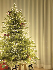 beautiful decorated Christmas tree. The image showcases a beautifully decorated Christmas tree adorned with red, gold, and brown ornaments